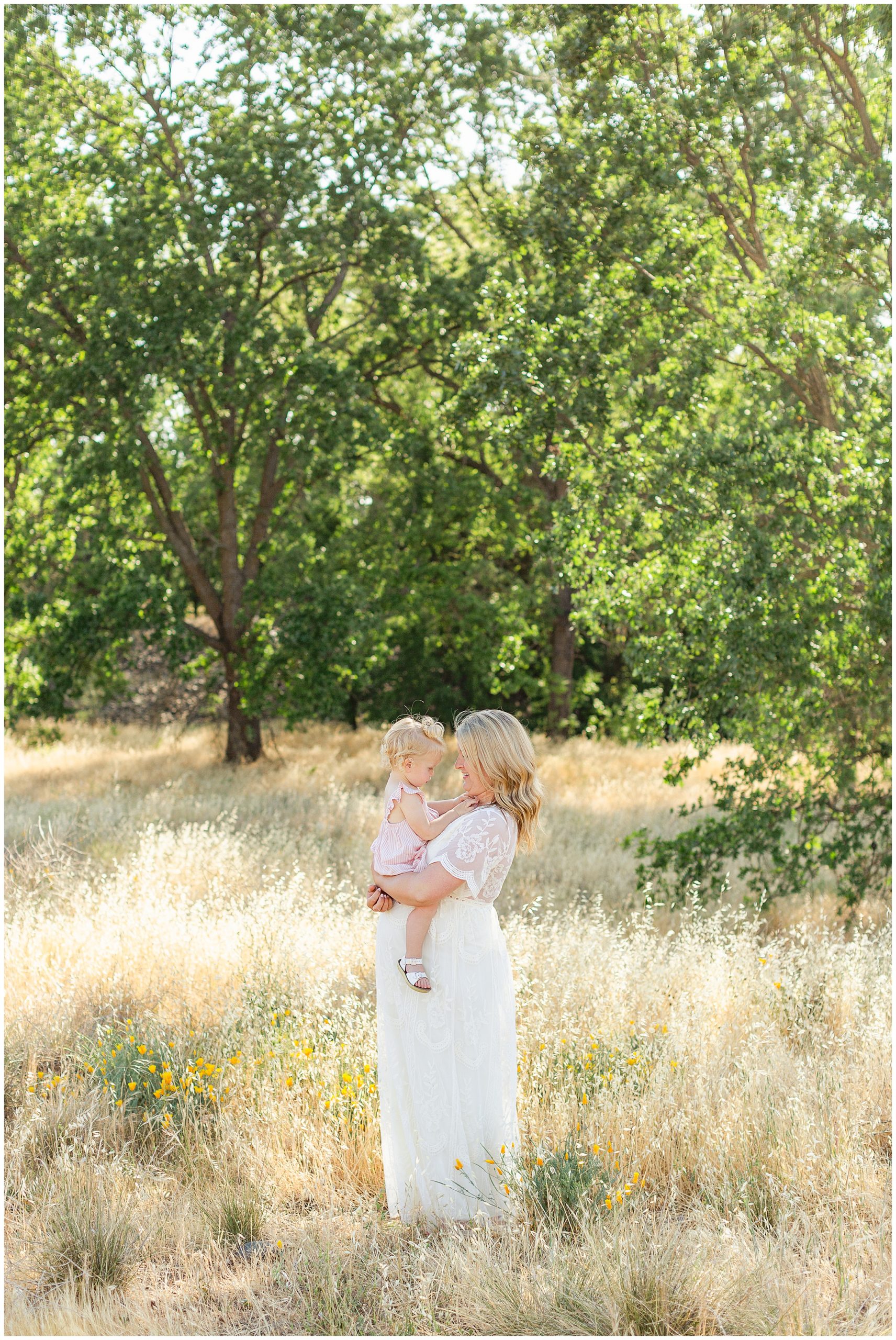 Mother Daughter Hugging in Poppies | Deidre + Jake