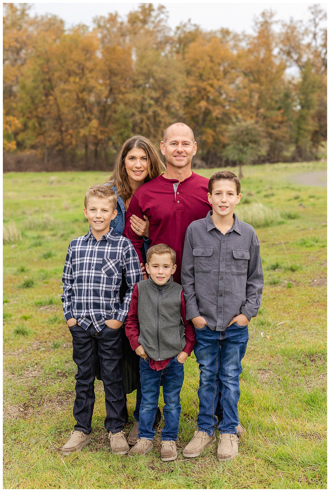Grass Field Fall Family Pictures in Black Dress and Red with Sons | Leah + Yancy