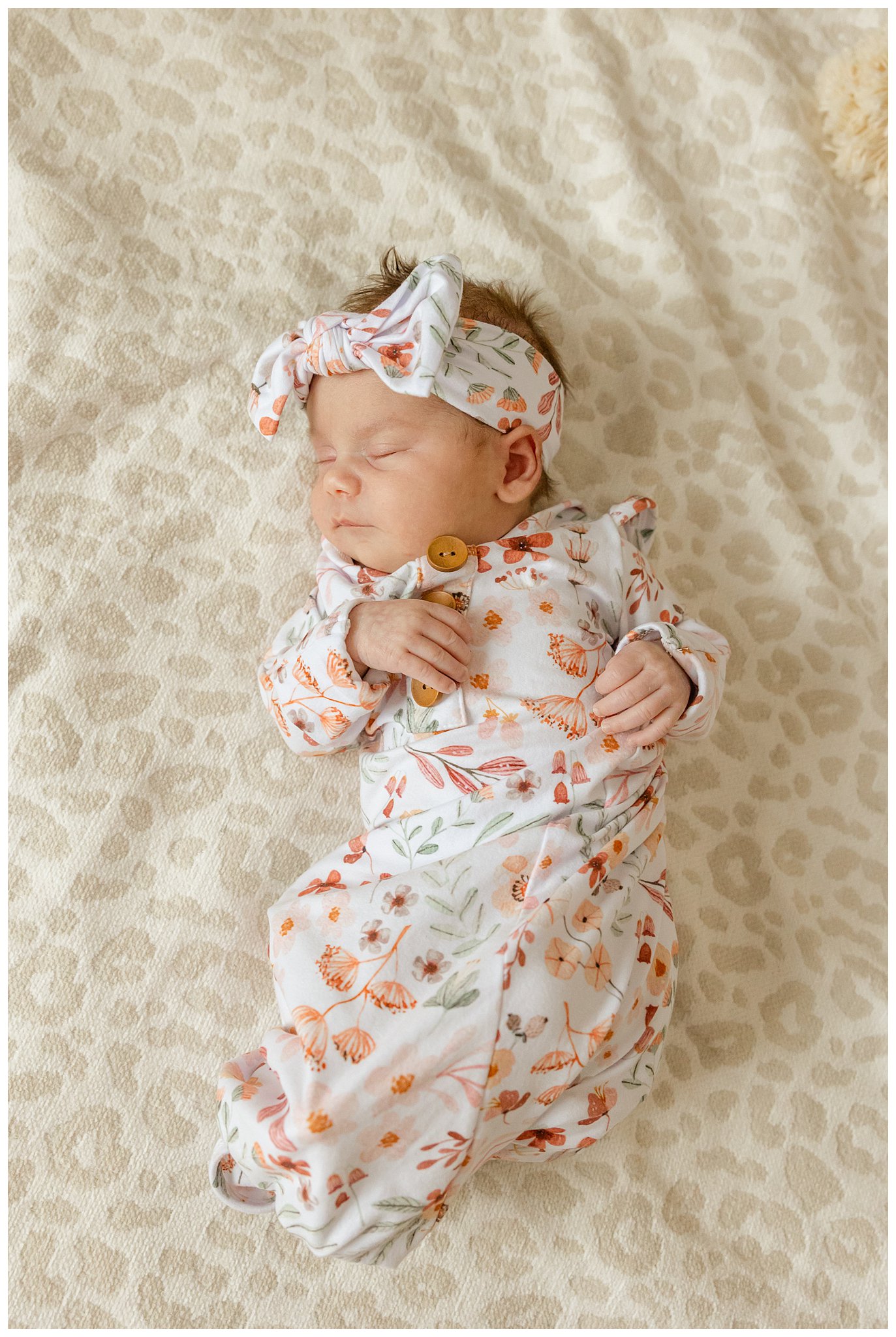 In Home Newborn Lifestyle Session with Baby Girl in Coordinating Bow and Gown | Noele + Sean