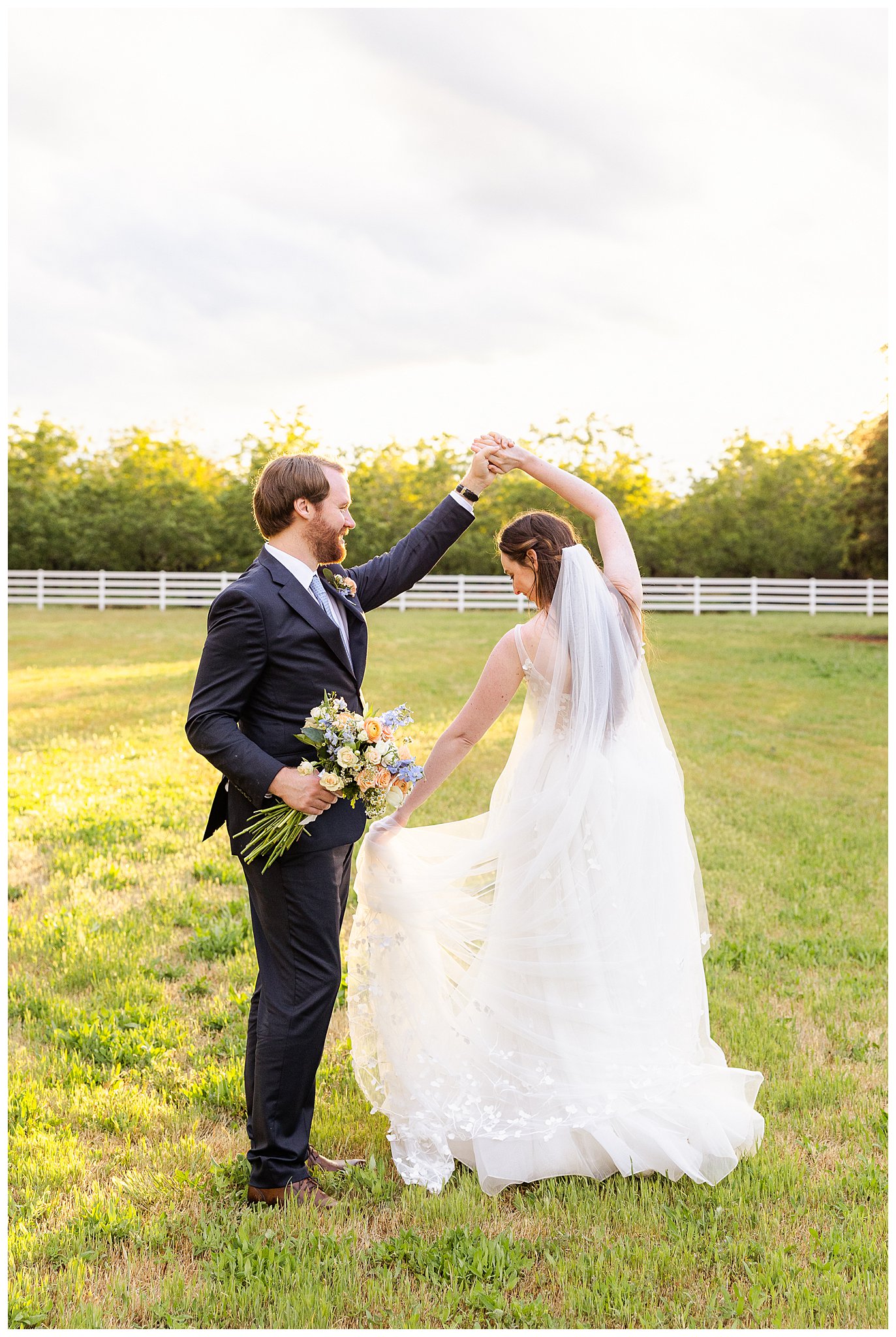 Bride and Groom Twirling After Storm at Irongate Garden Inn | Karen + Steven